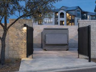 Example photo: a cleared compactor enclosure at dusk
